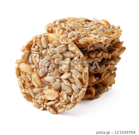 Delicious round seed snacks stacked together showcasing a healthy treat option for any time of day 121939704