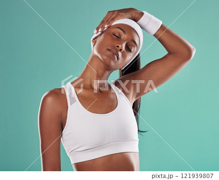Stretching, a healthy and beautiful sports woman in a neck stretch before a workout or game. Fit athlete or trainer, girl with a healthy lifestyle, in performance gear and ready for training session Stretching, a healthy and beautiful sports woman in a neck stretch before a workout or game. Fit athlete or trainer, girl with a healthy lifestyle, in performance gear and ready for training session 121939807