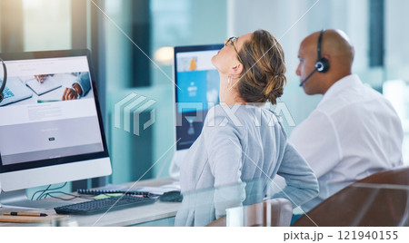 Stressed, overworked or stretching sales consultant, telemarketing operator or call center agent working on website. Tired customer support employee suffering from bad posture at contact us helpdesk Stressed, overworked or stretching sales consultant, telemarketing operator or call center agent working on website. Tired customer support employee suffering from bad posture at contact us helpdesk 121940155