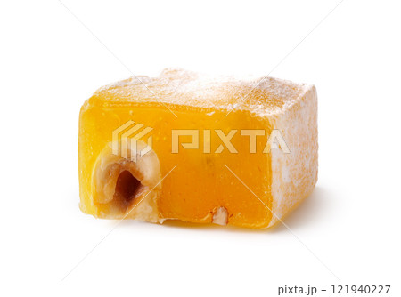 Unique square confection with almond filling and powdered sugar on a white background Unique square confection with almond filling and powdered sugar on a white background 121940227