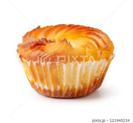Delightful buttercream pastry topped with a golden swirl on a white background 121940234