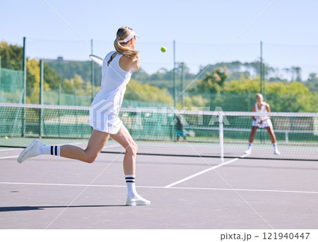 Fitness, balance and sport with woman tennis players practice competitive match at a sport court. Professional athlete workout at a game or competition. Lady training sports together with partner Fitness, balance and sport with woman tennis players practice competitive match at a sport court. Professional athlete workout at a game or competition. Lady training sports together with partner 121940447