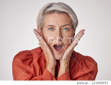 Shocked, surprised and old face of a beautiful senior woman with a wow facial expression. Portrait of an old and elderly female in shock about a retail sale deal, secret or good news or announcement 121940455