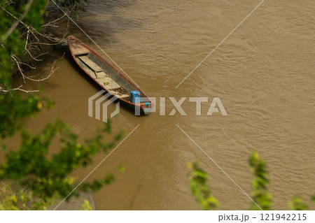 Canoe Moored on a Riverbank Canoe Moored on a Riverbank 121942215