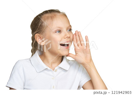 Caucasian young girl shouting cheerfully in white polo, expressive joy Caucasian young girl shouting cheerfully in white polo, expressive joy 121942903