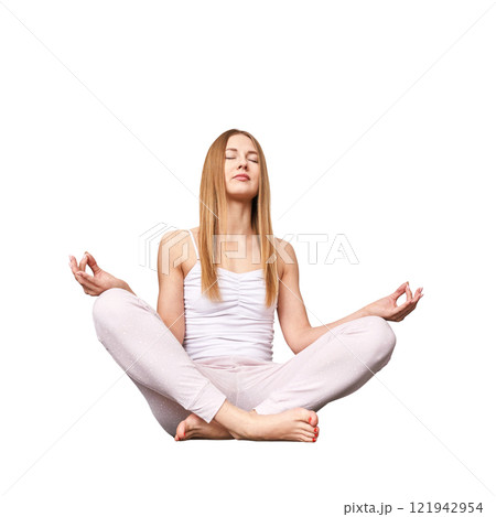 Young caucasian female practicing meditation in relaxed lotus pose with closed 121942954