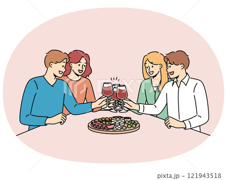 People drink wine with friends and eat snacks during friday night party in restaurant 121943518