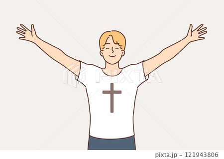 Religious man feels free and empowered by faith, dressed in t-shirt with crucifix on chest 121943806