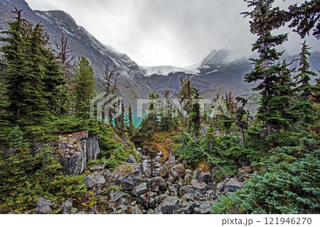 Hiking view near Mt Garibaldi with turquoise lake and dramatic clouds in the mountains 121946270
