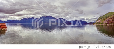 Scenic view over Howe Sound near Vancouver with mountains and water under cloudy sky Scenic view over Howe Sound near Vancouver with mountains and water under cloudy sky 121946280