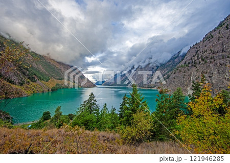Hiking view near Mt Garibaldi with turquoise lake and dramatic clouds in the mountains 121946285