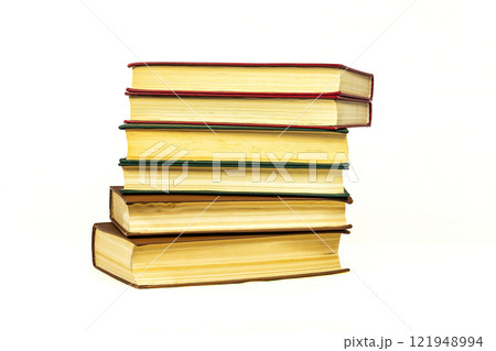 On a light surface there is a stoppin of several books 121948994