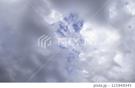 Overcast sky with dark clouds. Dark sky before a thunder-storm. The gray cloud background before rain. Overcast sky with dark clouds. Dark sky before a thunder-storm. The gray cloud background before rain. 121949345