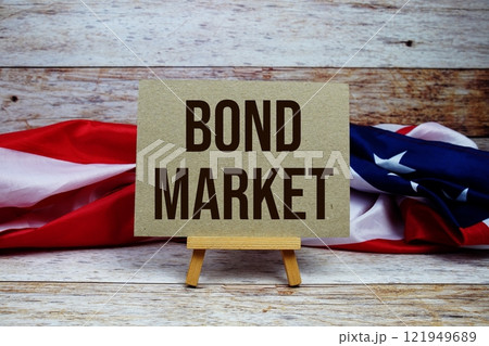 Bond Market text messege with USA flag on wooden background Bond Market text messege with USA flag on wooden background 121949689