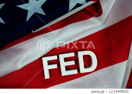 The Federal Reserve (FED) alphabet letters with USA flag background, Economy and Business concept The Federal Reserve (FED) alphabet letters with USA flag background, Economy and Business concept 121949693