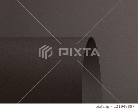 Charcoal gray paper background with curved, matte surfaces and subtle textured shadows. Bold dark Charcoal gray paper background with curved, matte surfaces and subtle textured shadows. Bold dark 121949887