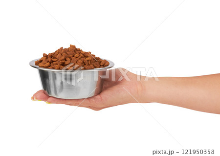 Bowl with animal food in hand Bowl with animal food in hand 121950358