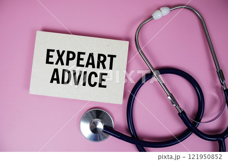 Expert Advice text with stethoscope on pink background, Healthy and wellness concept 121950852