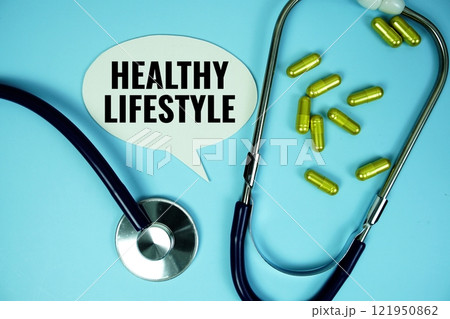 Health Lifestyle text with stethoscope and capsule medicine on blue background, Healthy and wellness concept Health Lifestyle text with stethoscope and capsule medicine on blue background, Healthy and wellness concept 121950862