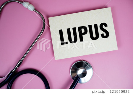 Lupus text with stethoscope on pink background, Healthy and wellness concept Lupus text with stethoscope on pink background, Healthy and wellness concept 121950922