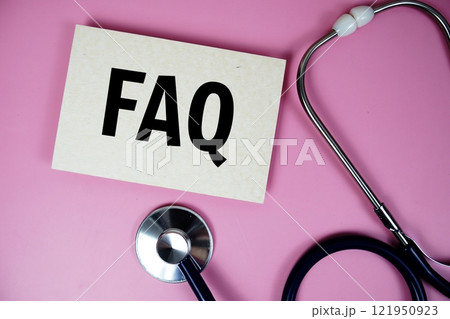 FAQ text with Stethoscope on pink background, Healthy and wellness concept FAQ text with Stethoscope on pink background, Healthy and wellness concept 121950923