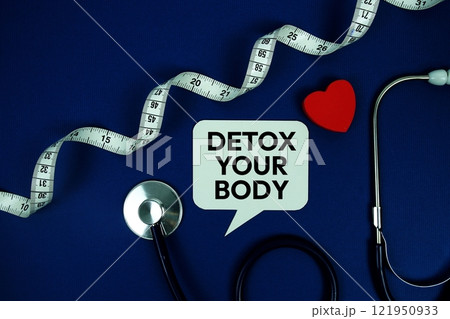Detox Your Body text on speech bubble with Red heart , measure tape and stethoscope on navy blue background, Healthy concept Detox Your Body text on speech bubble with Red heart , measure tape and stethoscope on navy blue background, Healthy concept 121950933