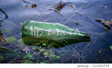 Plastic bottle floating on a river, symbolizing water pollution, environmental damage, and the urgent need for sustainable solutions and conservation efforts 121954774