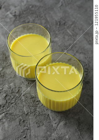 Moon or turmeric milk, concept of tasty drink Moon or turmeric milk, concept of tasty drink 121955110