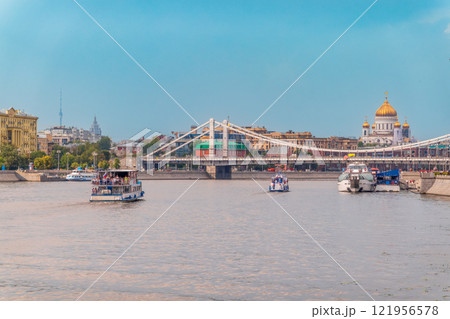 Cruise ship sails on the Moscow river in Moscow city center, popular place for walking. Cruise ship sails on the Moscow river in Moscow city center, popular place for walking. 121956578