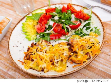 French style meat with potatoes and vegetable salad 121957007