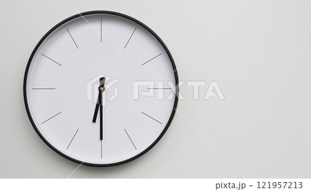Wall Clock Showing 18.30/06.30 O'Clock on White Wooden Surface - Perfect for Time Management and Scheduling Concepts Wall Clock Showing 18.30/06.30 O'Clock on White Wooden Surface - Perfect for Time Management and Scheduling Concepts 121957213