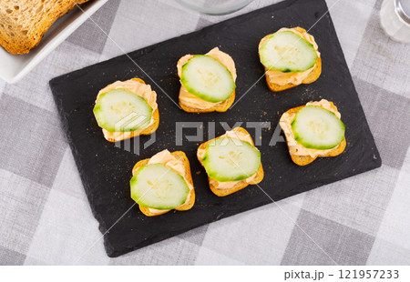 Tasty snack before lunch - sandwiches with cucumber and pate Tasty snack before lunch - sandwiches with cucumber and pate 121957233