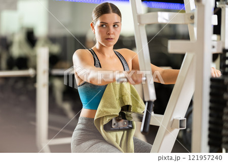 Woman doing back exercises Woman doing back exercises 121957240