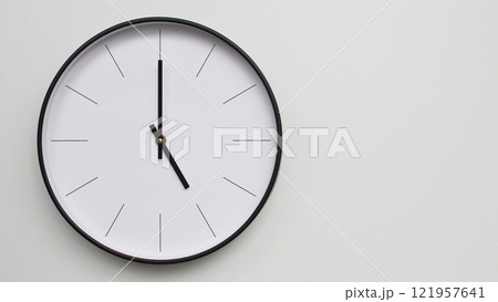 Wall Clock Showing 17.00/05.00 O'Clock on White Wooden Surface - Perfect for Time Management and Scheduling Concepts 121957641