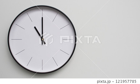 Wall Clock Showing 23.00/11.00 O'Clock on White Wooden Surface - Perfect for Time Management and Scheduling Concepts 121957785