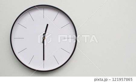 Wall Clock Showing 12.30/06.30 O'Clock on White Wooden Surface - Perfect for Time Management and Scheduling Concepts 121957865