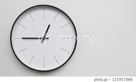 Wall Clock Showing 12.45/06.45 O'Clock on White Wooden Surface - Perfect for Time Management and Scheduling Concepts 121957866