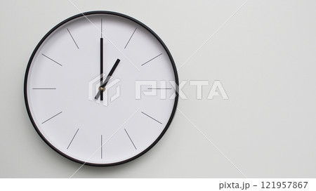 Wall Clock Showing 13.00/01.00 O'Clock on White Wooden Surface - Perfect for Time Management and Scheduling Concepts 121957867