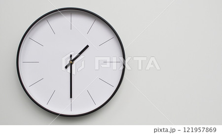 Wall Clock Showing 13.30/01.30 O'Clock on White Wooden Surface - Perfect for Time Management and Scheduling Concepts 121957869