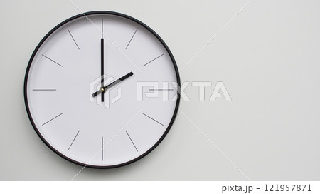 Wall Clock Showing 14.00/02.00 O'Clock on White Wooden Surface - Perfect for Time Management and Scheduling Concepts 121957871