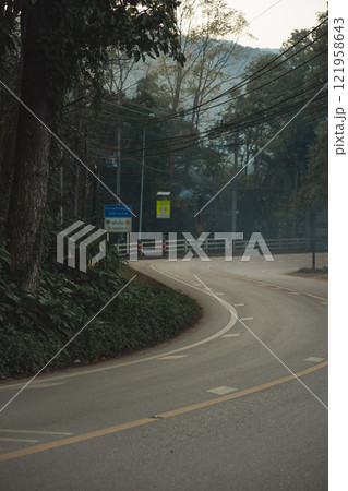 travel and people activity concept with tropical forest with country road and pine tree on mountain travel and people activity concept with tropical forest with country road and pine tree on mountain 121958643