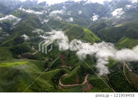 Landscape of Morning Mist with Mountain Layer. mountain ridge and clouds in rural jungle bush forest 121959458