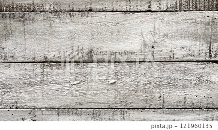 Weathered White Wooden Planks Background.A close-up view of weathered white wooden planks. 121960135
