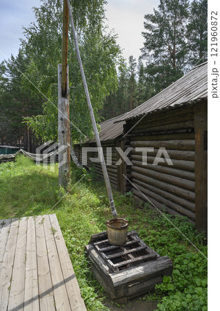A well with a crane lifting mechanism of the 19th century in Ulan-Ude, Russia A well with a crane lifting mechanism of the 19th century in Ulan-Ude, Russia 121960872