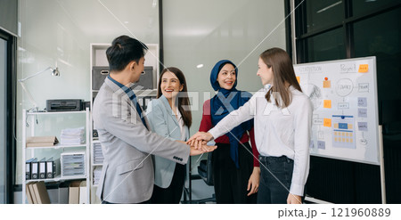 Teamwork business concept of group of three coworkers join hand together during their meeting. Teamwork business concept of group of three coworkers join hand together during their meeting. 121960889