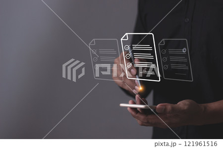 Young man with smartphone mobile hand using a pen touching to sign a Online Business Contract 121961516