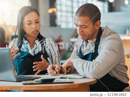 Small business owners discussing and planning startup growth, budget and expenses in the cafe or coffee shop. Entrepreneurs having a financial discussion about the business finance strategy 121961662