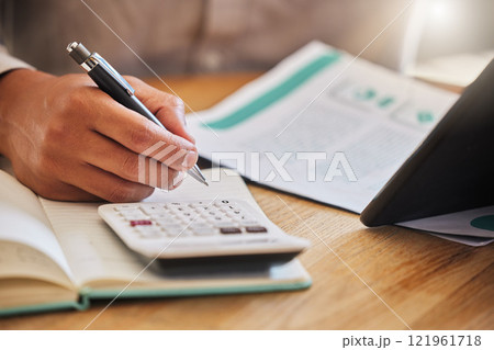 Accountant or financial advisor calculating the tax, expenses or budget for a business in an office. Closeup of male investment consultant hands working and writing company finance statement 121961718
