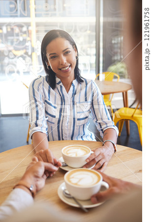 Happy, relax and in love couple holding hands on a coffee date at cafe, bonding and sharing romantic moment. Pov of a girlfriend from a boyfriend loving and flirting, showing care with sweet gesture Happy, relax and in love couple holding hands on a coffee date at cafe, bonding and sharing romantic moment. Pov of a girlfriend from a boyfriend loving and flirting, showing care with sweet gesture 121961758