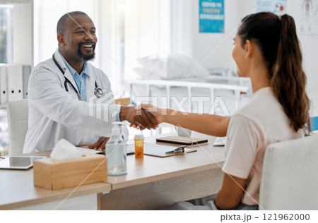 Healthcare, insurance and handshake between a doctor and patient consulting in an office, discussing a treatment plan. Happy woman smiling, satisfied with expert advice from health care professional Healthcare, insurance and handshake between a doctor and patient consulting in an office, discussing a treatment plan. Happy woman smiling, satisfied with expert advice from health care professional 121962000